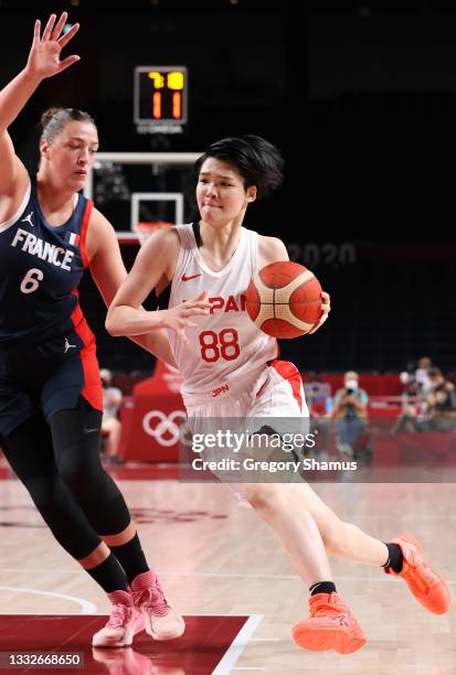 Himawari Akaho of Team Japan drives to the basket against Alexia Chartereau of Team France during the first half of a Women's Basketball Semifinals...