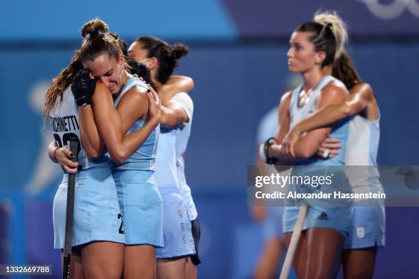 Eugenia Maria Trinchinetti and Sofia Toccalino of Team Argentina embrace following a loss in the Women's Gold Medal match between Netherlands and...