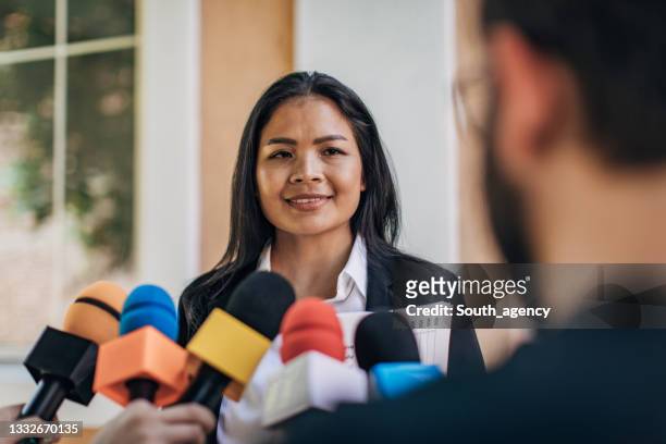 asian politician speaking to reporters - news event stock pictures, royalty-free photos & images