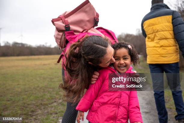 kisses for my cute daughter - jacket stock pictures, royalty-free photos & images