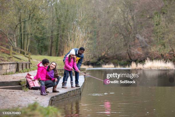 let's catch some fish! - black couple standing proud uk stock pictures, royalty-free photos & images