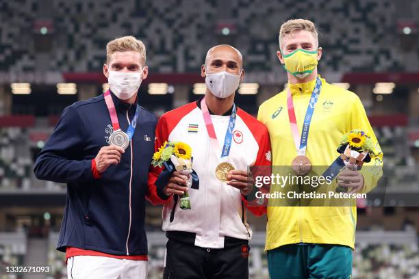 Silver medalist Kevin Mayer of Team France, gold medalist Damian Warner of Team Canada and bronze medalist Ashley Moloney of Team Australia stand on...