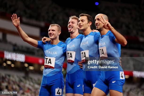 Alessandro Sibilio, Vladimir Aceti, Edoardo Scotti and Davide Re of Team Italy pose for a photo after the Men's 4 x 400m Relay on day fourteen of the...
