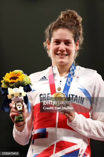 Kate French of Team Great Britain poses with the gold medal during the Women's Modern Pentathlon medal ceremony on day fourteen of the Tokyo 2020...