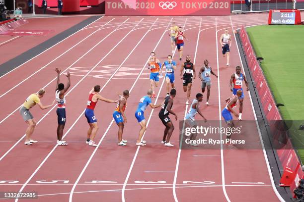 General view as the athletes prepare for a Baton exchange during the Men's 4 x 400m Relay heats on day fourteen of the Tokyo 2020 Olympic Games at...