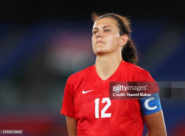 Christine Sinclair of Team Canada stands for the national anthem prior to the Women's Gold Medal Match between Canada and Sweden on day fourteen of...