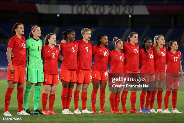 Players of Team Canada stand for the national anthem prior to the Women's Gold Medal Match between Canada and Sweden on day fourteen of the Tokyo...
