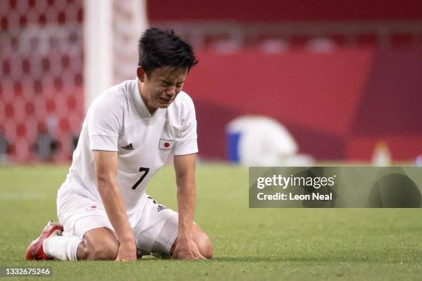 Takefusa Kubo of Team Japan looks dejected following defeat in the Men's Bronze Medal Match between Mexico and Japan on day fourteen of the Tokyo...