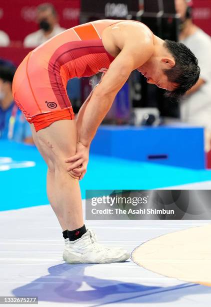 Yuki Takahashi of Team Japan shows dejection after his defeat by Nurislam Sanayev of Kazakhstan in the Men's Freestyle 57kg 1/4 final on day twelve...