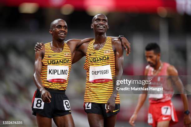 Joshua Cheptegei of Team Uganda reacts as he wins the gold medal in the Men's 5000m Final alongside teammate Jacob Kiplimo on day fourteen of the...