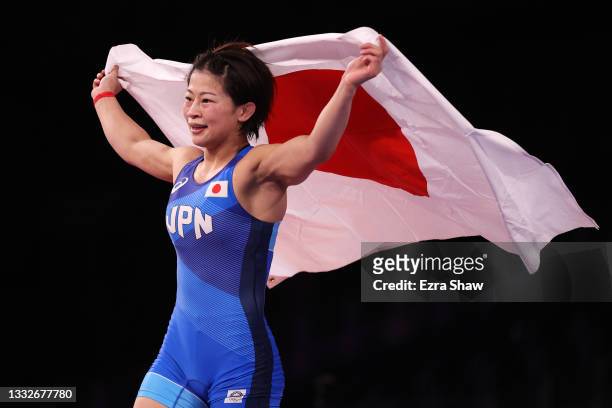 Mayu Mukaida of Team Japan celebrates defeating Qianyu Pang of Team China during the Women’s Freestyle 53kg Gold Medal Match on day fourteen of the...