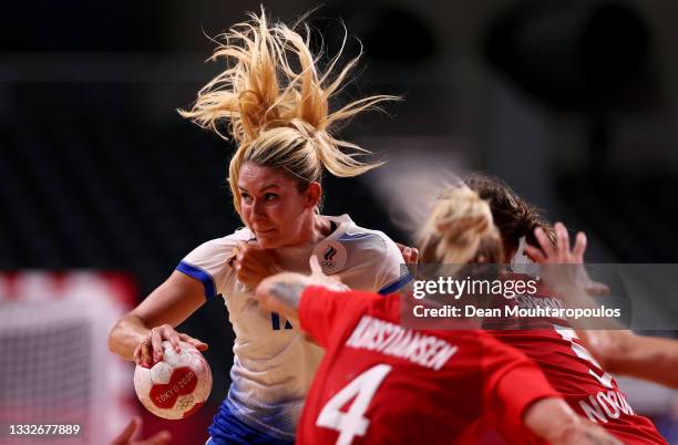 Vladlena Bobrovnikova of Team ROC is challenged by Marit Malm Frafjord of Team Norway during the Women's Semifinal handball match between Norway and...