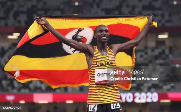 Gold medal winner Joshua Cheptegei of Team Uganda celebrates after the Men's 5000 metres final day fourteen of the Tokyo 2020 Olympic Games at...