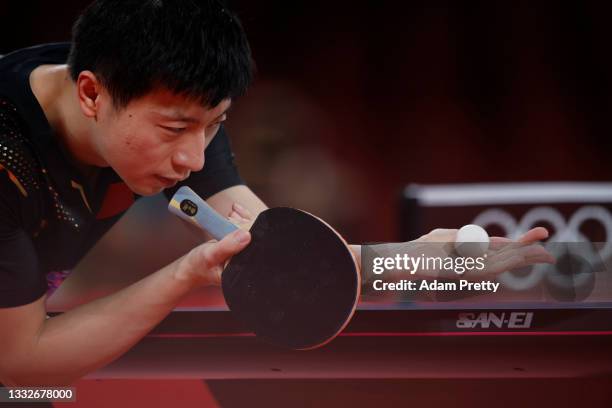 Ma Long of Team China serves the ball during his Men's Team Gold Medal table tennis match on day fourteen of the Tokyo 2020 Olympic Games at Tokyo...