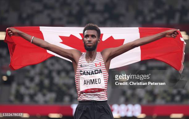 Mohammed Ahmed of Team Canada celebrates after winning the silver medal in the Men's 5000m Final on day fourteen of the Tokyo 2020 Olympic Games at...