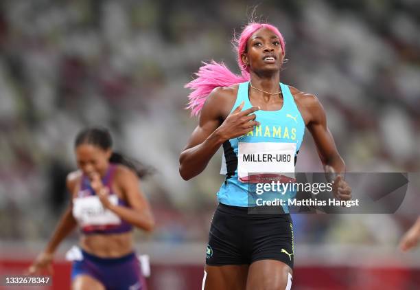 Shaunae Miller-Uibo of Team Bahamas crosses the line to win the gold medal during the Women's 400 metres final on day fourteen of the Tokyo 2020...