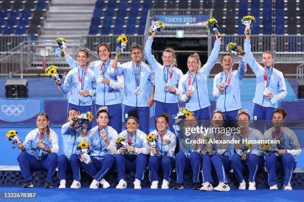 Team Argentina pose with their Silver Medals during the Victory Ceremony following the Women's Gold Medal match between Netherlands and Argentina on...