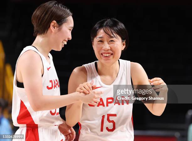 Saori Miyazaki and Nako Motohashi of Team Japan celebrate following Japan's victover over Team France in a Women's Basketball Semifinals game on day...