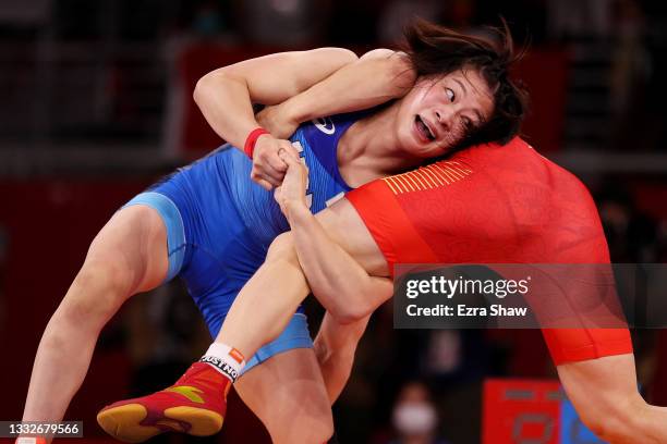 Mayu Mukaida of Team Japan competes against Qianyu Pang of Team China during the Women’s Freestyle 53kg Gold Medal Match on day fourteen of the Tokyo...