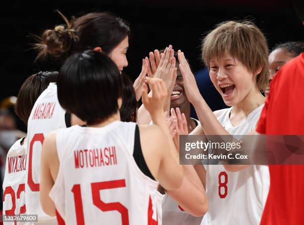 Maki Takada of Team Japan celebrates with her teammates following their victory over Team France in a Women's Basketball Semifinals game between Team...