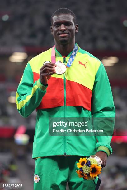 Bronze medalist Kirani James of Team Grenada holds up his medal on the podium during the medal ceremony for the Men’s 400m on day fourteen of the...