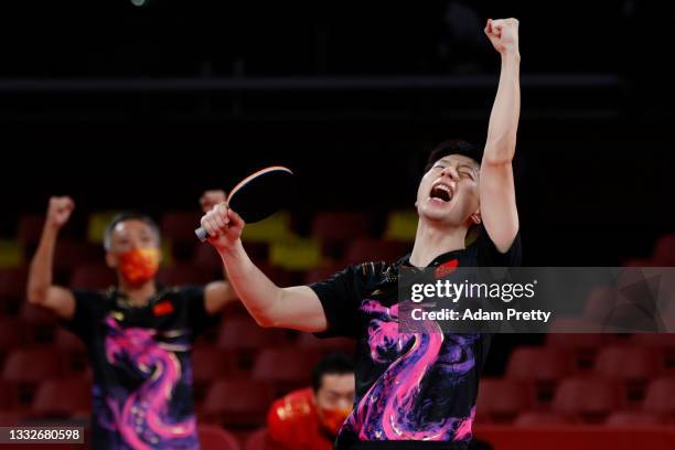 Ma Long of Team China celebrates winning his Men's Team Gold Medal table tennis match on day fourteen of the Tokyo 2020 Olympic Games at Tokyo...