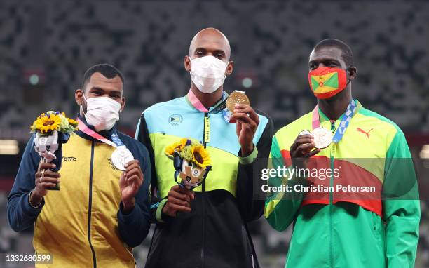 Silver medallist Anthony Jose Zambrano of Team Colombia, gold medalist Steven Gardiner of Team Bahamas and bronze medalist Kirani James of Team...