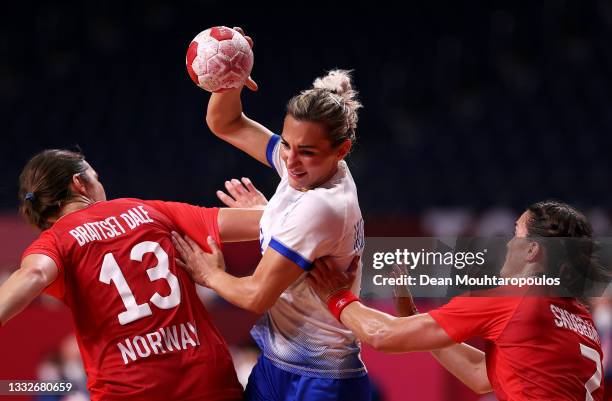 Polina Kuznetsova of Team ROC runs with the ball while under pressure from Kari Brattset Dale and Stine Skogrand of Team Norway during the Women's...