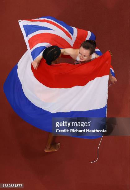 Silver medalist Laura Muir of Team Great Britain and bronze medalist Sifan Hassan of Team Netherlands embrace following the Women's 1500m Final on...