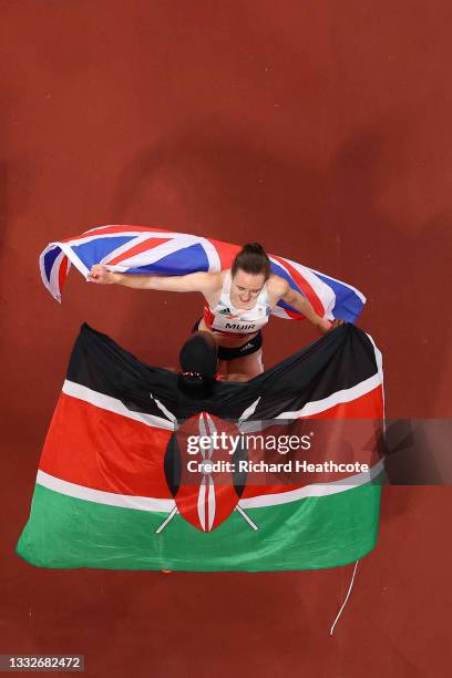 Silver medalist Laura Muir of Team Great Britain and gold medalist Faith Kipyegon of Team Kenya embrace following the Women's 1500m Final on day...