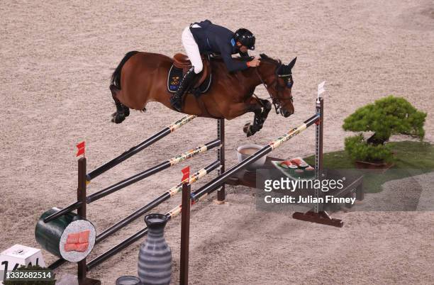 Peder Fredricson of Team Sweden riding All In competes during the Equestrian Jumping Team Qualifier on day fourteen of the Tokyo 2020 Olympic Games...