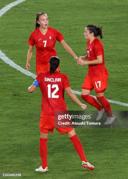 Jessie Fleming of Team Canada celebrates with Julia Grosso and Christine Sinclair after scoring their side's first goal during the Women's Gold Medal...