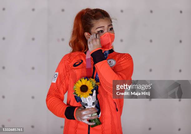 Miho Nonaka of Team Japan reacts as she poses with the silver medal for Sport Climbing Women's Combined after during the Sport Climbing Women's...