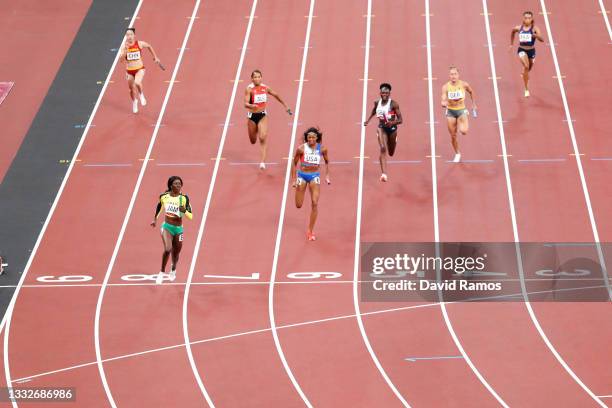 Shericka Jackson of Team Jamaica crosses the finish line to win the gold medal in the Women's 4 x 100m Relay Final on day fourteen of the Tokyo 2020...