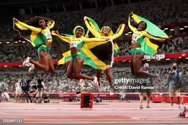 Briana Williams, Elaine Thompson-Herah, Shelly-Ann Fraser-Pryce and Shericka Jackson of Team Jamaica celebrate winning the gold medal in the Women's...