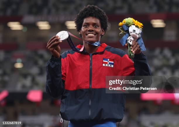 Silver medalist Marileidy Paulino of Team Dominican Republic holds up her medal on the podium during the Women's 400m medal ceremony on day fourteen...