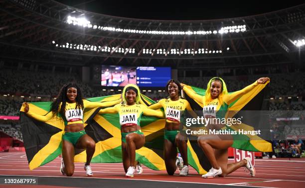 Briana Williams, Elaine Thompson-Herah, Shelly-Ann Fraser-Pryce and Shericka Jackson of Team Jamaica celebrate winning the gold medal in the Women's...