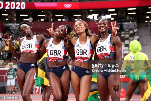 Asha Philip, Imani Lansiquot, Dina Asher-Smith and Daryll Neita of Team Great Britain celebrate winning the bronze medal in the Women's 4 x 100m...