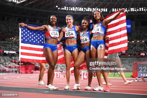 Javianne Oliver, Teahna Daniels, Jenna Prandini and Gabrielle Thomas of Team United States celebrate winning the silver medal in the Women's 4 x 100m...