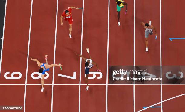 Filippo Tortu of Team Italy beats Nethaneel Mitchell-Blake of Team Great Britain across the finish line to win the gold medal in the Men's 4 x 100m...