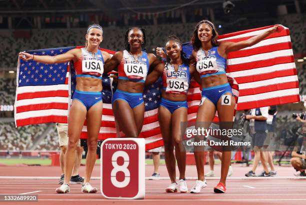 Javianne Oliver, Teahna Daniels, Jenna Prandini and Gabrielle Thomas of Team United States celebrate winning the silver medal in the Women's 4 x 100m...