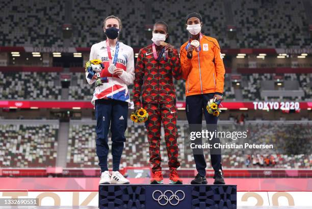 Silver medalist Laura Muir of Team Great Britain, gold medalist Faith Kipyegon of Team Kenya, and bronze medalist Sifan Hassan of Team Netherlands...
