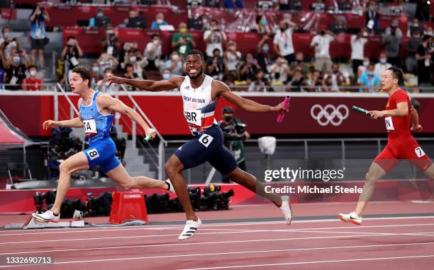 Filippo Tortu of Team Italy beats Nethaneel Mitchell-Blake of Team Great Britain across the finish line to win the gold medal in the Men's 4 x 100m...