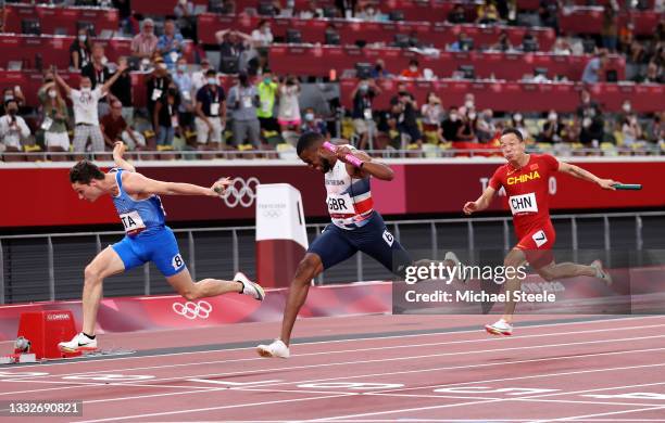 Filippo Tortu of Team Italy beats Nethaneel Mitchell-Blake of Team Great Britain across the finish line to win the gold medal in the Men's 4 x 100m...