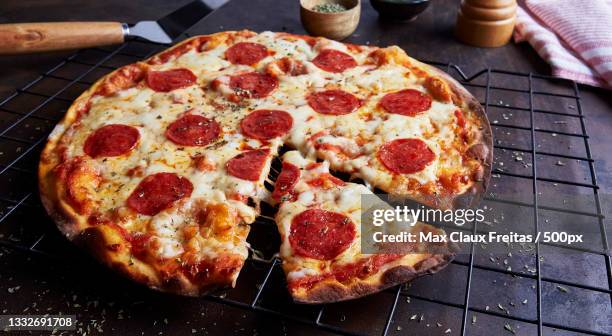 high angle view of pizza on table - casa sezione foto e immagini stock