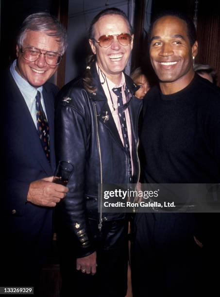 Actor Larry Hagman, Peter Fonda and O.J. Simpson attend the opening of Harley Davidson Cafe on October 19, 1993 in New York City.