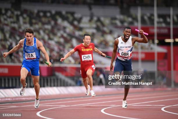 Filippo Tortu of Team Italy beats Nethaneel Mitchell-Blake of Team Great Britain across the finish line to win the gold medal in the Men's 4 x 100m...