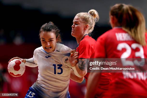 Anna Vyakhireva of Team ROC runs with the ball while under pressure from Veronica Kristiansen of Team Norway as Camilla Herrem of Team Norway looks...