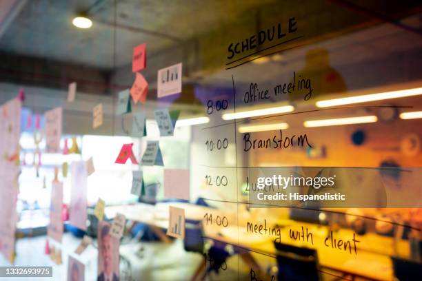 office schedule on a board at a conference room - 2021 planner stock pictures, royalty-free photos & images