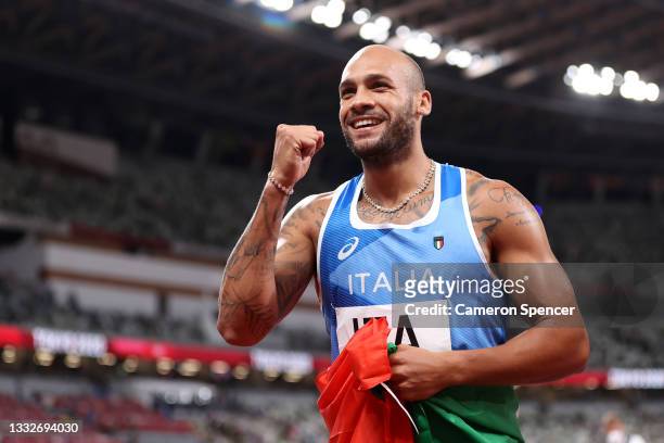Lamont Marcell Jacobs of Team Italy celebrates winning the gold medal in the Men's 4 x 100m Relay Final on day fourteen of the Tokyo 2020 Olympic...